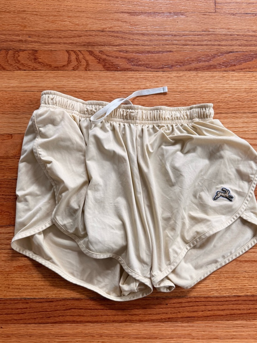 EUC Tracksmith twilight split shorts, light yellow